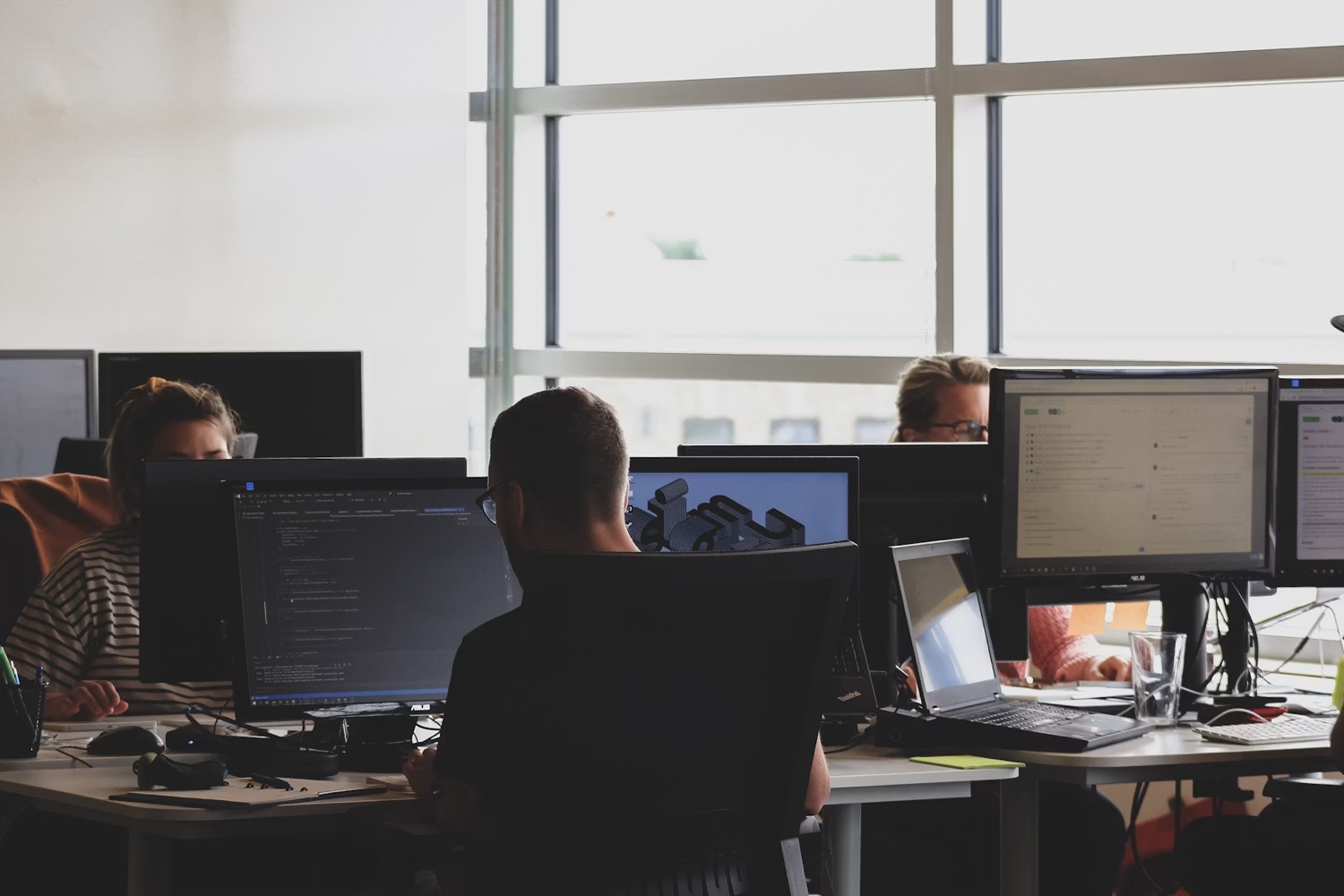 The engineering team working in the office